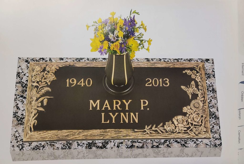 bronze on granite marker with vase