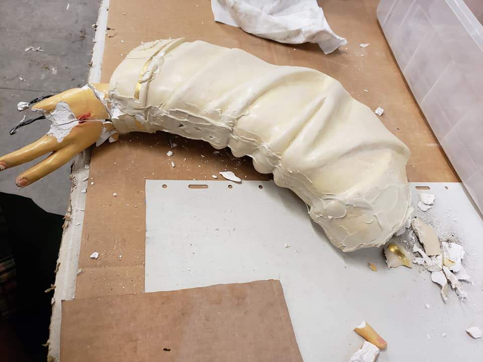 Broken arm of plaster statue